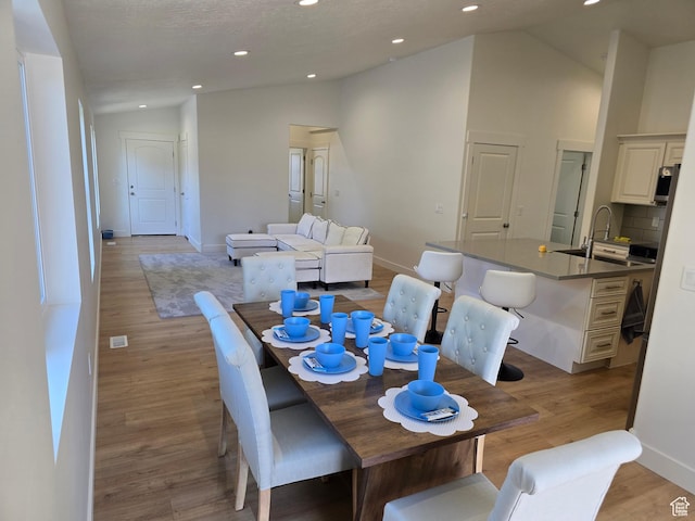 92 N 300 W, American Fork, UT 84003 - dining space with vaulted ceiling, light wood-style floors, baseboards, and recessed lighting