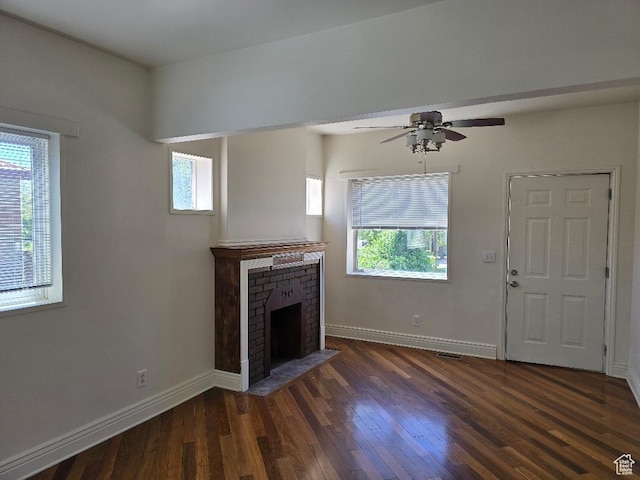 567 S 800 E, Salt Lake City, UT 84102 - unfurnished living room featuring healthy amount of natural light, dark wood-style floors, and baseboards