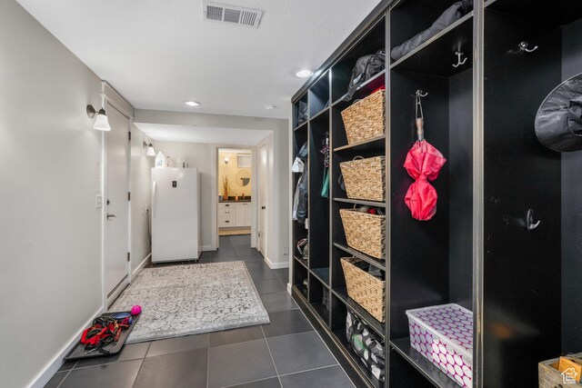 3273 E Bernada Dr, Salt Lake City, UT 84124 - mudroom featuring dark tile patterned flooring, recessed lighting, and visible vents