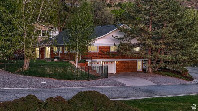 3273 E Bernada Dr, Salt Lake City, UT 84124 - view of front of house with a garage, concrete driveway, and a front lawn