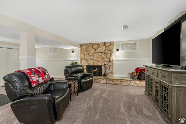 3273 E Bernada Dr, Salt Lake City, UT 84124 - carpeted living area with a fireplace, visible vents, and a wainscoted wall
