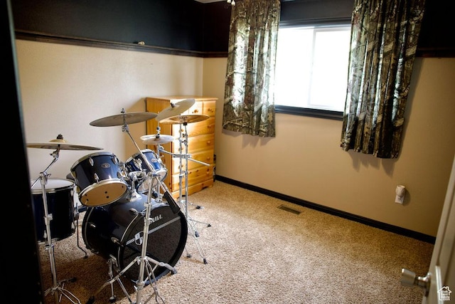 game room featuring baseboards, carpet flooring, and visible vents