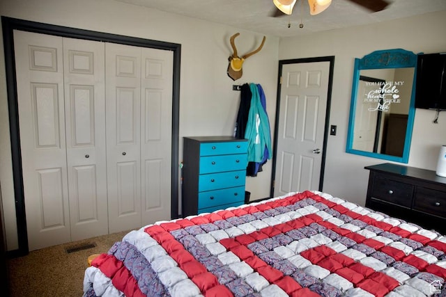 carpeted bedroom featuring ceiling fan, a closet, and visible vents
