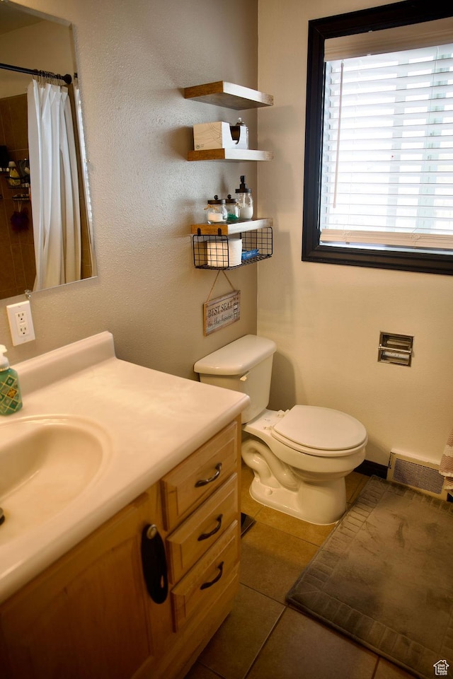 bathroom with tile patterned flooring, visible vents, vanity, curtained shower, and toilet