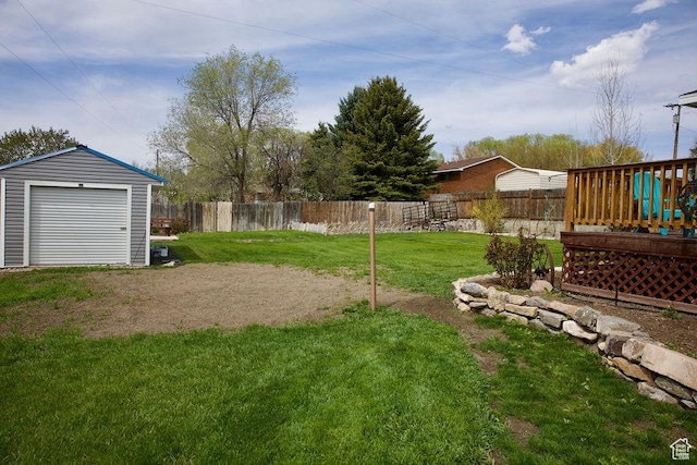 view of yard featuring a fenced backyard and an outbuilding