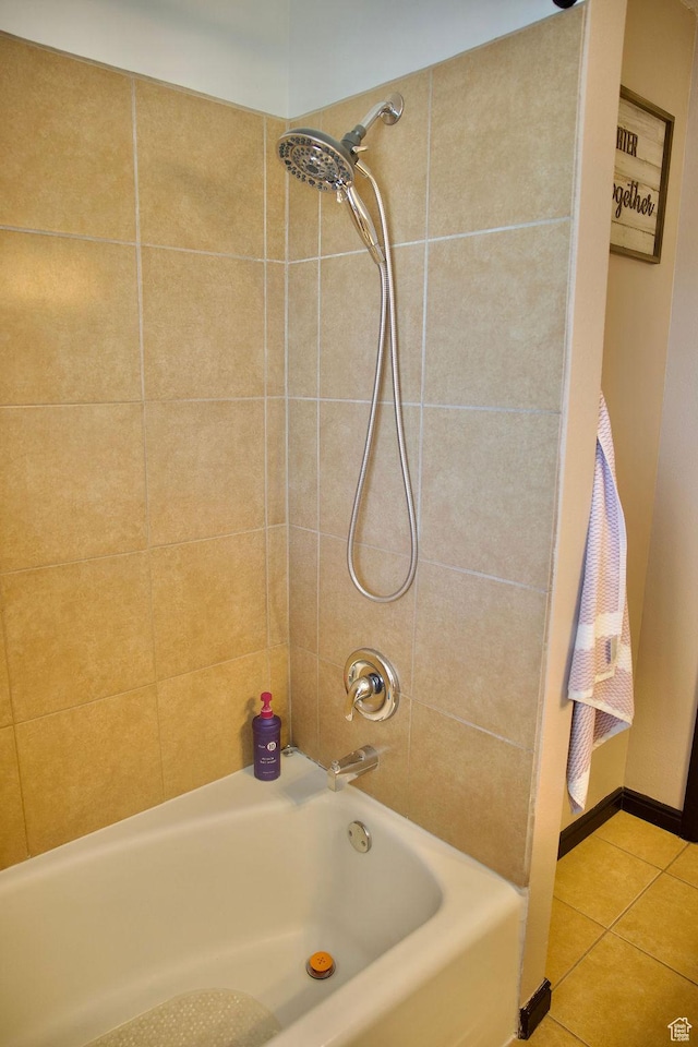bathroom with tile patterned flooring and tub / shower combination
