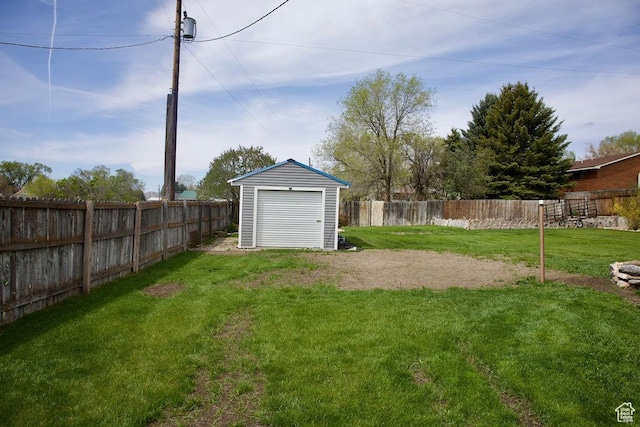 view of yard with a fenced backyard, a storage unit, and an outdoor structure