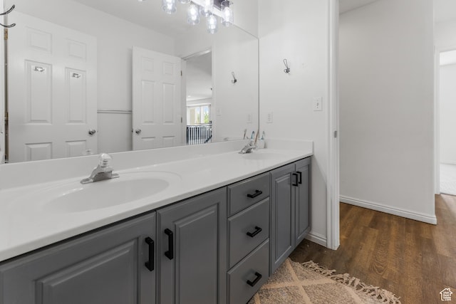 531 E Valley Dr, Heber City, UT 84032 - full bathroom with double vanity, baseboards, a sink, and wood finished floors