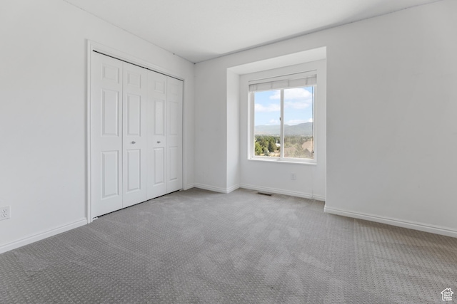 531 E Valley Dr, Heber City, UT 84032 - unfurnished bedroom with carpet floors, baseboards, visible vents, and a closet
