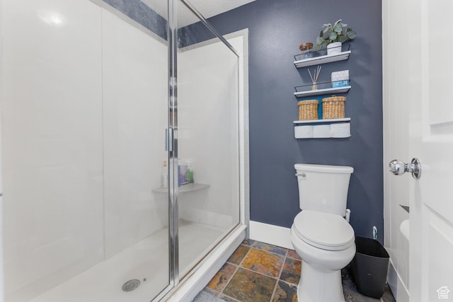 531 E Valley Dr, Heber City, UT 84032 - full bath featuring toilet, baseboards, stone tile flooring, and a stall shower