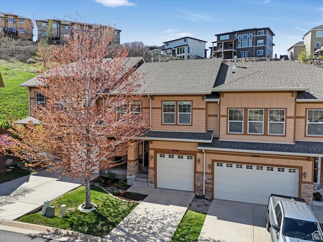 14768 S Deer Park Ln E, Draper Ut Cnty, UT 84020 - townhome / multi-family property with driveway, a shingled roof, stone siding, and a garage