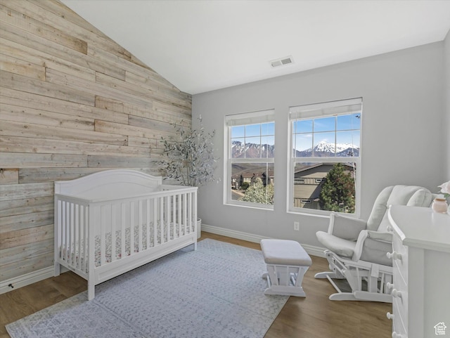 14768 S Deer Park Ln E, Draper Ut Cnty, UT 84020 - bedroom with vaulted ceiling, wood walls, wood finished floors, and visible vents