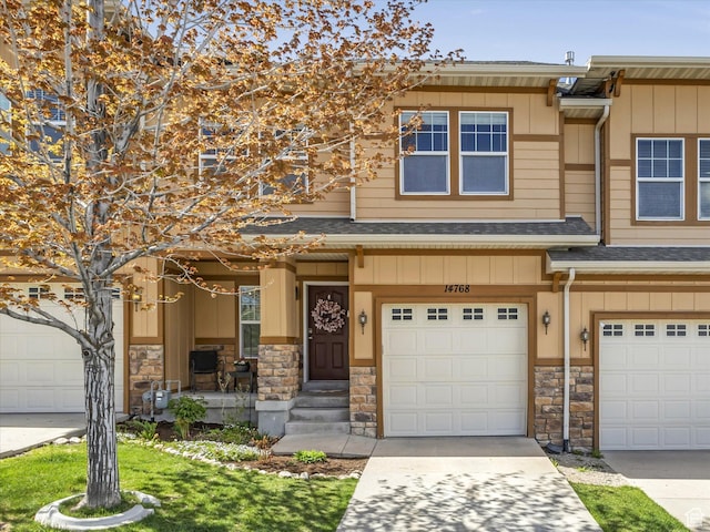 14768 S Deer Park Ln E, Draper Ut Cnty, UT 84020 - townhome / multi-family property featuring roof with shingles, board and batten siding, an attached garage, and stone siding