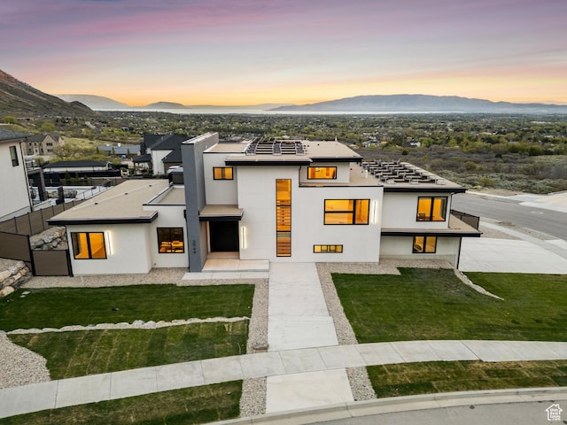 3944 W Oak Hill Dr, Alpine, UT 84004 - view of front of house with a mountain view, a front yard, and stucco siding