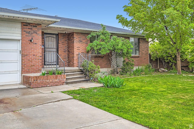 4758 S Mocha Dr W, Taylorsville, UT 84129 - view of front facade featuring a front lawn and brick siding