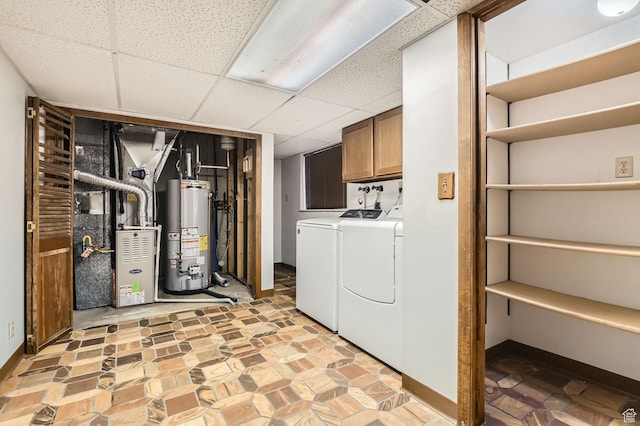 4758 S Mocha Dr W, Taylorsville, UT 84129 - washroom featuring cabinet space, baseboards, water heater, separate washer and dryer, and heating unit