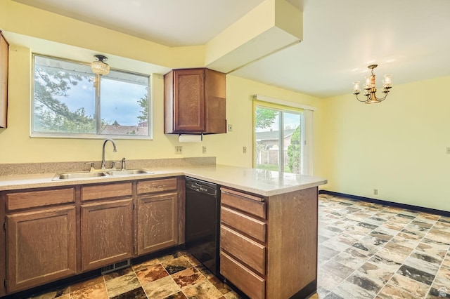 4758 S Mocha Dr W, Taylorsville, UT 84129 - kitchen featuring a sink, light countertops, a peninsula, a chandelier, and black dishwasher