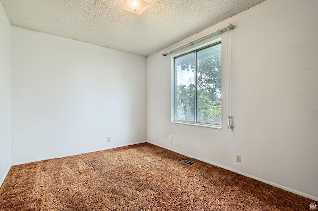 4758 S Mocha Dr W, Taylorsville, UT 84129 - spare room featuring visible vents, carpet flooring, a textured ceiling, and baseboards