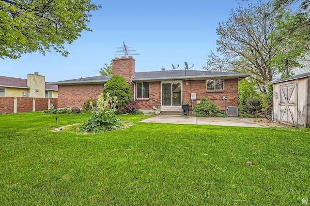 4758 S Mocha Dr W, Taylorsville, UT 84129 - back of house featuring cooling unit, a shed, a patio area, entry steps, and a yard