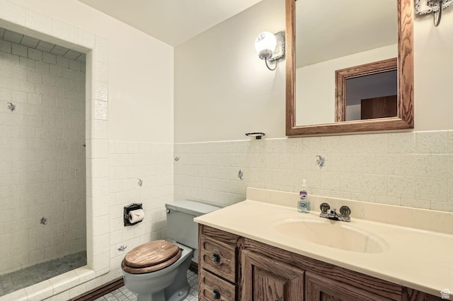 4758 S Mocha Dr W, Taylorsville, UT 84129 - full bath with vanity, wainscoting, toilet, tile walls, and a tile shower