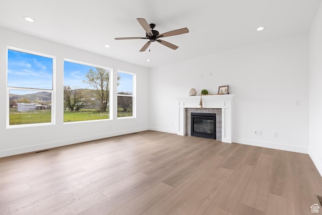 544 N 350 W Unit 7R, Morgan, UT 84050 - unfurnished living room featuring wood finished floors, ceiling fan, a glass covered fireplace, recessed lighting, and baseboards