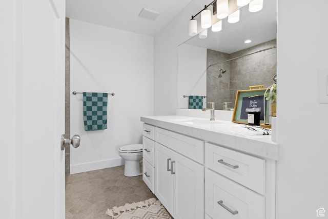 544 N 350 W Unit 7R, Morgan, UT 84050 - bathroom featuring toilet, tiled shower, vanity, and baseboards