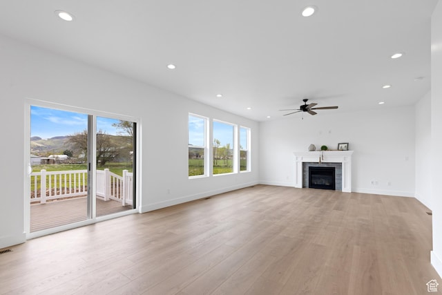 544 N 350 W Unit 7R, Morgan, UT 84050 - unfurnished living room featuring ceiling fan, light wood-type flooring, recessed lighting, a tile fireplace, and baseboards