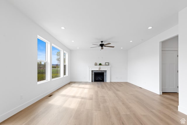 544 N 350 W Unit 7R, Morgan, UT 84050 - unfurnished living room with a ceiling fan, light wood-type flooring, recessed lighting, baseboards, and a fireplace
