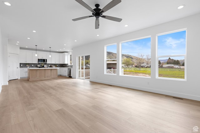 544 N 350 W Unit 7R, Morgan, UT 84050 - unfurnished living room with recessed lighting, light wood-type flooring, a ceiling fan, and baseboards
