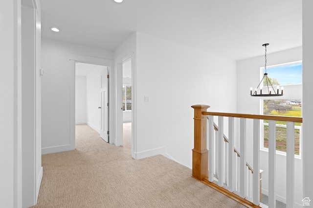 544 N 350 W Unit 7R, Morgan, UT 84050 - corridor featuring a chandelier, an upstairs landing, recessed lighting, light colored carpet, and baseboards
