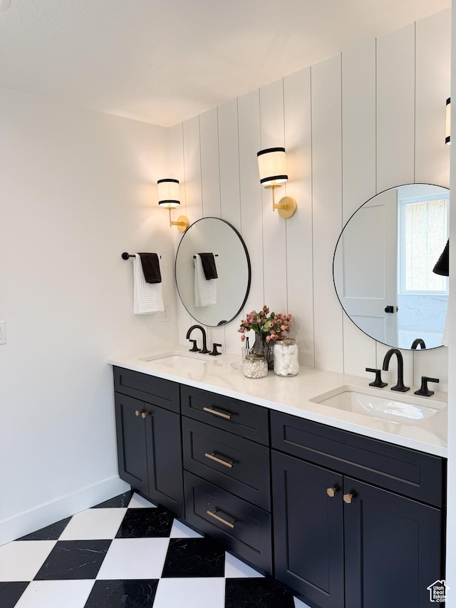 7648 S Iron Cyn Unit 341, West Jordan, UT 84081 - full bathroom featuring double vanity, a sink, baseboards, and tile patterned floors