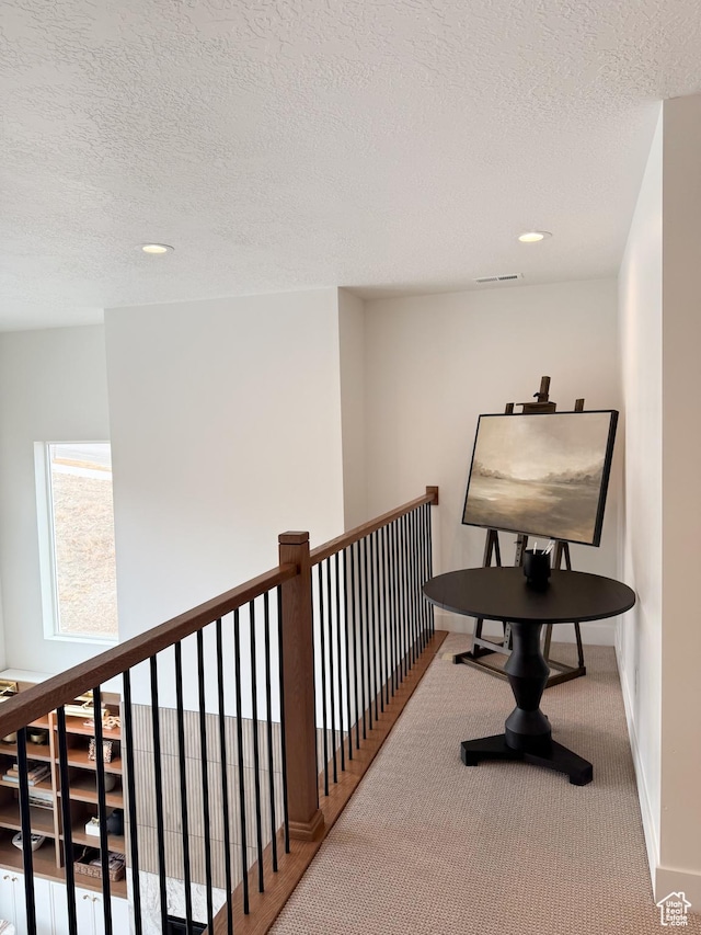 7648 S Iron Cyn Unit 341, West Jordan, UT 84081 - hall with recessed lighting, a textured ceiling, baseboards, and visible vents
