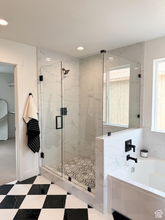 7648 S Iron Cyn Unit 341, West Jordan, UT 84081 - bathroom featuring a textured ceiling, tile patterned floors, a marble finish shower, recessed lighting, and a bath