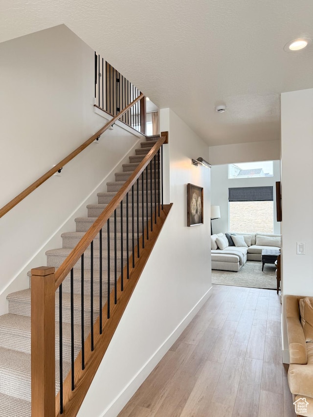 7648 S Iron Cyn Unit 341, West Jordan, UT 84081 - stairs with baseboards, recessed lighting, and wood finished floors