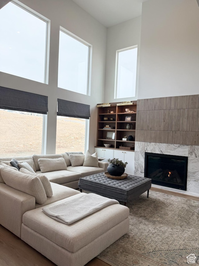 7648 S Iron Cyn Unit 341, West Jordan, UT 84081 - living area with a high ceiling and a fireplace