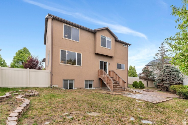7812 N Crestwood Cir, Eagle Mountain, UT 84005 - rear view of property featuring a patio area and stucco siding