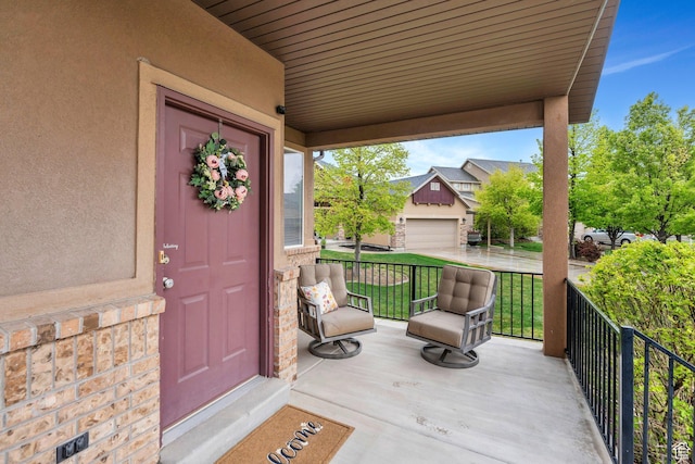 7812 N Crestwood Cir, Eagle Mountain, UT 84005 - doorway to property featuring covered porch and stucco siding