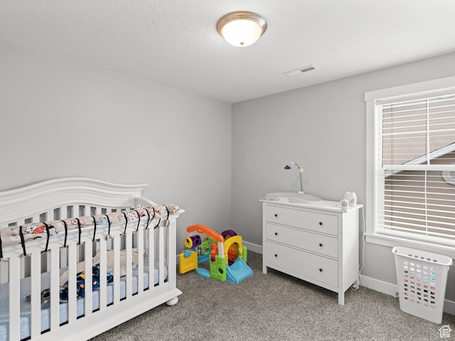 1227 W 20 S, Pleasant Grove, UT 84062 - bedroom with a textured ceiling, visible vents, baseboards, a crib, and carpet