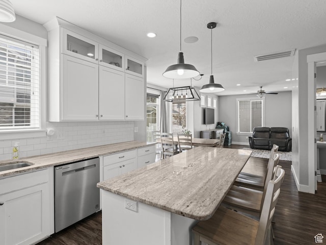 1227 W 20 S, Pleasant Grove, UT 84062 - kitchen with decorative backsplash, dark wood-type flooring, white cabinetry, and dishwasher