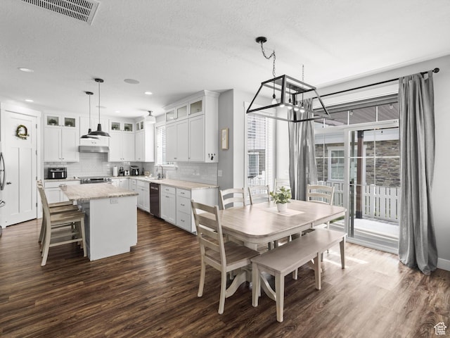 1227 W 20 S, Pleasant Grove, UT 84062 - dining area with dark wood-style flooring, a notable chandelier, a textured ceiling, recessed lighting, and visible vents