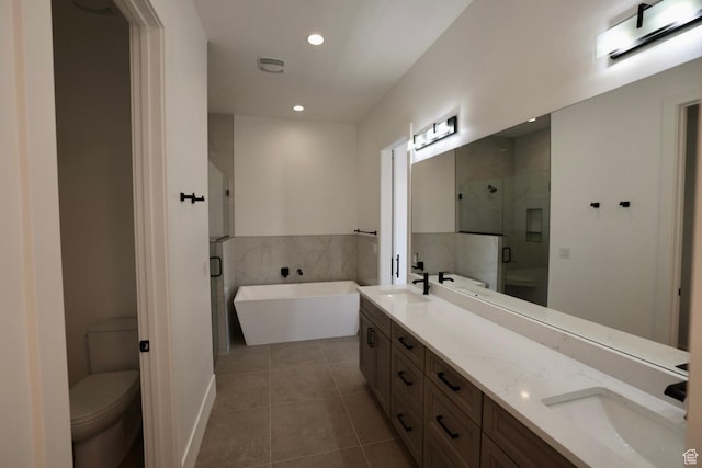3842 S Kennedy Ln Unit 124, Washington, UT 84780 - bathroom with double vanity, tile patterned flooring, a shower stall, a sink, and toilet