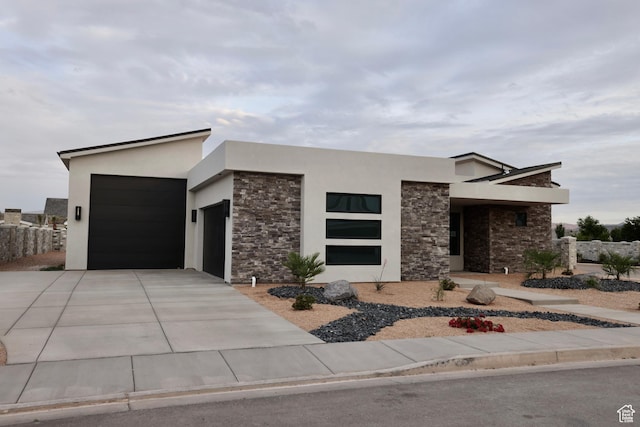 3842 S Kennedy Ln Unit 124, Washington, UT 84780 - contemporary house featuring a garage, stucco siding, concrete driveway, and stone siding