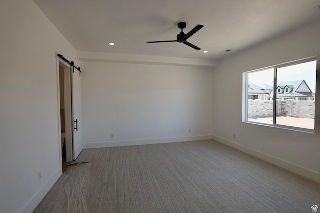 3842 S Kennedy Ln Unit 124, Washington, UT 84780 - empty room featuring a ceiling fan, light colored carpet, recessed lighting, and a barn door