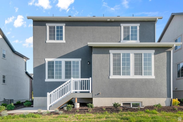6636 W Spring Snow Ln, Herriman, UT 84096 - view of front of house featuring stucco siding and a patio area