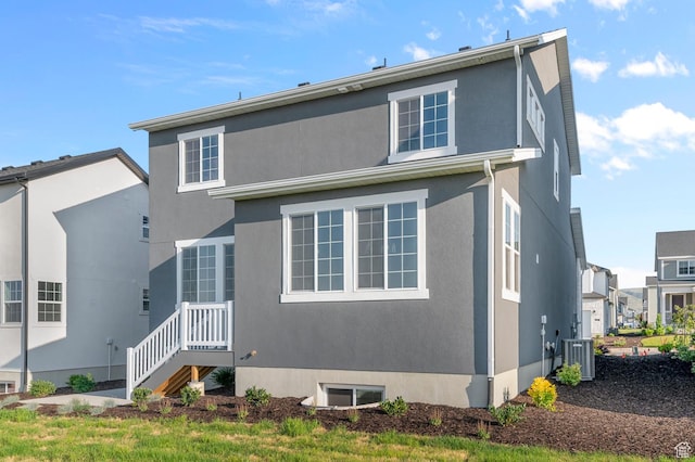 6636 W Spring Snow Ln, Herriman, UT 84096 - rear view of property featuring stucco siding