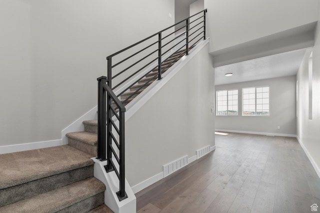 6636 W Spring Snow Ln, Herriman, UT 84096 - stairway with wood finished floors and baseboards