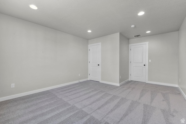 6636 W Spring Snow Ln, Herriman, UT 84096 - spare room with recessed lighting, carpet, and a textured ceiling