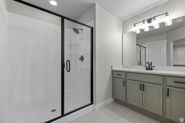 6636 W Spring Snow Ln, Herriman, UT 84096 - full bathroom with a stall shower, tile patterned floors, and vanity