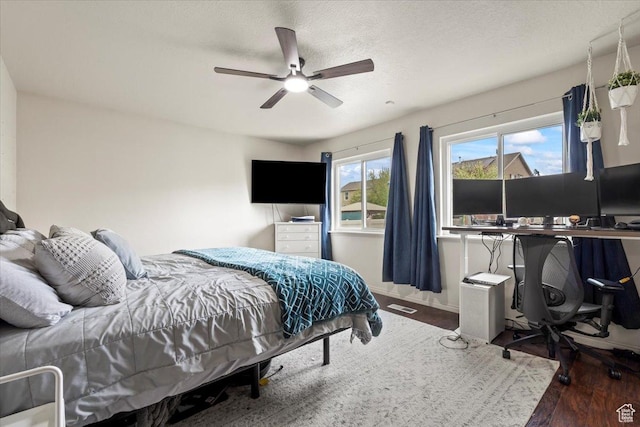 2099 E Hickock Way, Eagle Mountain, UT 84005 - bedroom featuring a desk, wood finished floors, a ceiling fan, and baseboards