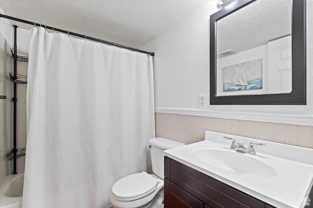 2099 E Hickock Way, Eagle Mountain, UT 84005 - full bathroom with a textured ceiling, a wainscoted wall, toilet, and vanity